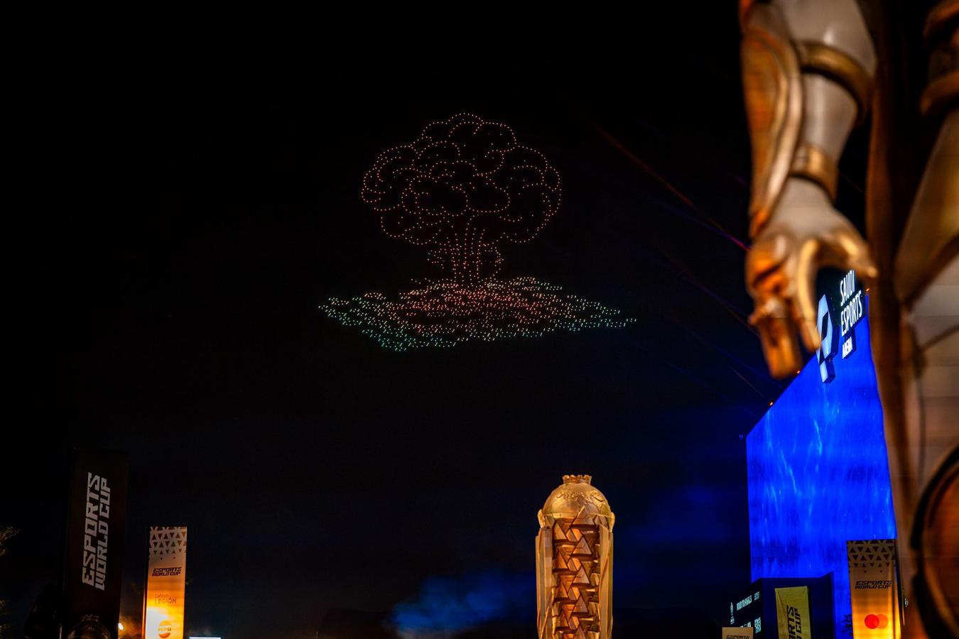 Drone show above Riyadh’s Boulevard City on July 10, 2025, marking the opening of the Esports World Cup as fans watch from below.